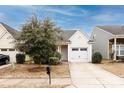 Attractive home with a manicured lawn, a paved driveway, and a welcoming entrance, radiating curb appeal at 5216 Crystal Lakes Dr, Rock Hill, SC 29732