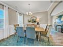 Inviting dining area with stylish lighting, elegant decor, and comfortable seating for memorable gatherings at 6265 Fairfax Ct, Maiden, NC 28650