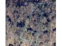 Aerial view of property boundaries showing proximity to neighboring homes and wooded area at 906 Forest Dr, Lancaster, SC 29720