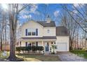 Lovely two-story home showcasing a well-maintained exterior, blue shutters and a welcoming front entrance at 1811 Endeavor Ln, Clover, SC 29710