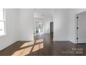 Bright and airy living room with hardwood floors and abundant natural light at 236 Victoria Ave, Charlotte, NC 28202