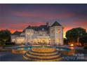 Impressive backyard with a multi-tiered pool, spa, and expansive patio perfect for entertaining at 2477 Peninsula Shores Ct, Denver, NC 28037