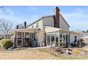 Back exterior of home with screened porch, sunroom, and landscaped yard at 2705 North Center St # 6, Hickory, NC 28601