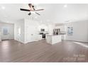 Open-concept design showcasing the living room, kitchen with island, and ample natural light at 3358 Burberry Dr, Gastonia, NC 28052