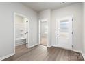 Bright entryway featuring wood-look flooring and doorways to the bathroom and a bedroom at 3527 Clover Valley Dr, Gastonia, NC 28052