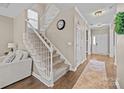 Welcoming foyer featuring a staircase, hardwood floors, neutral walls, and an elegant entryway at 437 Buttermere Rd # 31, Fort Mill, SC 29715