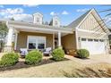 Inviting front porch featuring seating, manicured bushes, and stone accents at 5252 Admirals Lndg, Lancaster, SC 29720