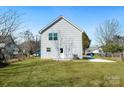 Spacious backyard with lush green grass, small concrete porch, and minimal landscaping at 81 Kirk St, Salisbury, NC 28144