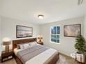 This staged main bedroom features new carpet, neutral paint and modern decor. A side window provides natural light at 845 Finley Rd, Rock Hill, SC 29730