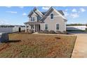 Charming two-story home featuring manicured landscaping and a welcoming front porch at 1010 Coppergate Dr, Salisbury, NC 28147