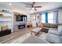Cozy living room with a modern fireplace, floating shelves, and a comfortable sectional sofa at 108 Oak Grove St, Kannapolis, NC 28081