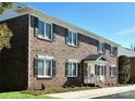 Charming brick exterior with classic windows and a welcoming front porch at 109 Stroupe Rd # E, Gastonia, NC 28056