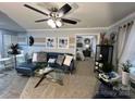 Stylish living room with elegant decor, comfortable seating, and a view into the bedroom at 109 Stroupe Rd # E, Gastonia, NC 28056
