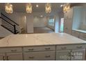 Stylish kitchen island featuring quartz countertops and ample cabinet space at 12027 Mariners Cove Ct # 381, Lancaster, SC 29720
