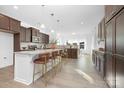 Spacious kitchen featuring a large island with seating, stainless appliances, and modern finishes at 25966 Appleyard Ct # 1205, Lancaster, SC 29720