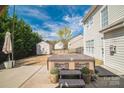 Backyard view of a hot tub surrounded by lush landscaping and a privacy fence at 279 Age Old Way, Rock Hill, SC 29732