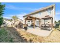 Spacious backyard featuring a large patio area with pergola, outdoor seating, and a fire pit at 279 Age Old Way, Rock Hill, SC 29732