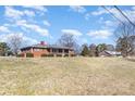 Traditional brick home with a large front yard and covered porch, set under a sunny sky at 290 S Enochville Ave, Kannapolis, NC 28081
