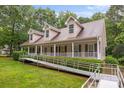 Charming one-story home with dormers,a welcoming front porch with ramp access and manicured lawn at 3039 Paraham S Rd, York, SC 29745