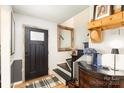 Inviting entryway with a decorative mirror, stylish accents, and a charming staircase at 307 Matthews Crossing Dr, Matthews, NC 28105
