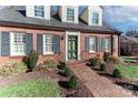 Charming home with brick pathway, shutters, and manicured landscaping at 632 N Oakland Ave # Pt1, Statesville, NC 28677