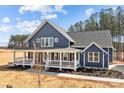 Beautiful two-story home with a spacious front porch, offering curb appeal and outdoor living at 117 Mills Garden Rd, Statesville, NC 28625