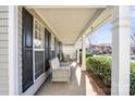 Relaxing covered porch featuring comfortable seating, providing a perfect spot for outdoor enjoyment at 11711 Royal Castle Ct, Charlotte, NC 28277