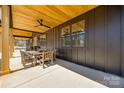 Spacious outdoor patio featuring a dining table, wood columns, and ceiling fan at 13546 W Highway 55 W Hwy, York, SC 29745