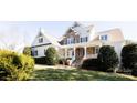 Charming two-story home with stone accents and well-manicured lawn at 152 Bay Shore Loop, Mooresville, NC 28117