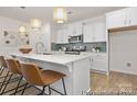 Stylish kitchen with a large island, quartz countertops, stainless steel appliances, and pendant lights at 159 Mooring Dr # 342Pp, Statesville, NC 28677