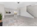 Bright and spacious living room with light wood floors, neutral walls, and ample natural light at 1612 Beleek Ridge Ln, Clover, SC 29710