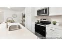 Modern kitchen featuring stainless steel oven and microwave with white cabinetry at 200 J.P. Dr # 184P, Albemarle, NC 28001