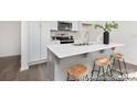 Bright kitchen features a large island with seating, stainless steel appliances at 200 J.P. Dr # 184P, Albemarle, NC 28001