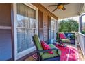 Cozy front porch seating with patterned cushions, overlooking the neighborhood, with warm, inviting colors at 210 Keltic Meadows Dr, Gastonia, NC 28056