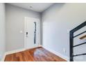 Bright entryway features hardwood floors, neutral walls, and a modern front door at 2123 Isom St, Charlotte, NC 28208