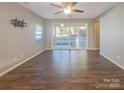 Bright and spacious living room with hardwood floors and sliding glass doors to the backyard at 23186 Goose Down Ln, Lancaster, SC 29720