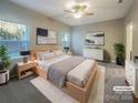 Staged main bedroom with a king-size bed, soft lighting, and neutral decor for a relaxing retreat at 23186 Goose Down Ln, Lancaster, SC 29720