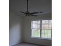 Bright bedroom featuring a ceiling fan, a large double window, and neutral carpet flooring at 4718 Sahalee Ln, Charlotte, NC 28216