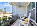Relaxing front porch featuring classic white rocking chairs with decorative pillows and flowers at 5019 Mill Creek Rd, Clover, SC 29710