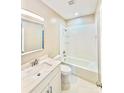 Bathroom features a combined tub and shower, modern fixtures and a neutral color scheme at 926 Poplar St, Albemarle, NC 28001