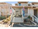 Townhome exterior with cozy front porch and stairs at 100 Willow Run Dr, Gastonia, NC 28056