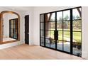 Bright foyer featuring sleek black framed windows and a light wood floor at 1004 Maxwell Ct # 1, Marvin, NC 28173