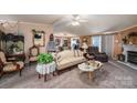 Cozy living room featuring a fireplace, neutral color palette, and comfortable seating at 120 Dixie Dr, Shelby, NC 28021
