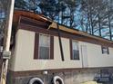 Close exterior of home with peeling roof shingles; showing condition at 1406 Ratchford Dr, Dallas, NC 28034