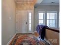 Inviting foyer with hardwood floors, a white door, and natural light from sidelight windows at 1529 Alex Dr, Shelby, NC 28152