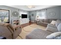 Bright living room featuring hardwood floors, neutral paint, large windows and comfortable seating at 17118 Frog Pond Rd, Oakboro, NC 28129