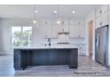 Bright kitchen showcasing stainless steel appliances, custom cabinetry, and a central island at 338 Shinnville Rd, Mooresville, NC 28115