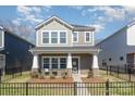 Charming two-story home with a welcoming front porch and manicured landscaping at 500 Cranford Dr # 73, Pineville, NC 28134