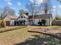 Charming single-story home with a well-manicured front yard and a quaint porch with a garden at 506 Coolidge Ct, Statesville, NC 28677