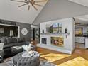 Open-concept living room with fireplace and hardwood floors at 506 Coolidge Ct, Statesville, NC 28677